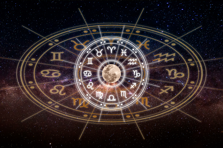 Astrological zodiac signs inside of horoscope circle. Astrology, knowledge of stars in the sky over the milky way and moon. The power of the universe concept.